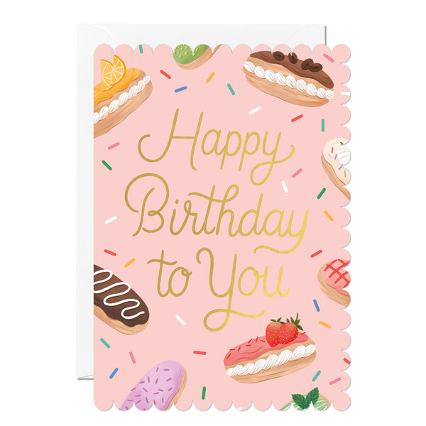 Birthday card with illustrations of eclairs on a pink background