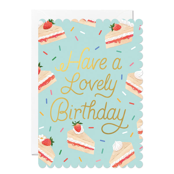 Birthday card with cake illustrations and 'Have a Lovely Birthday' text on a light blue background.