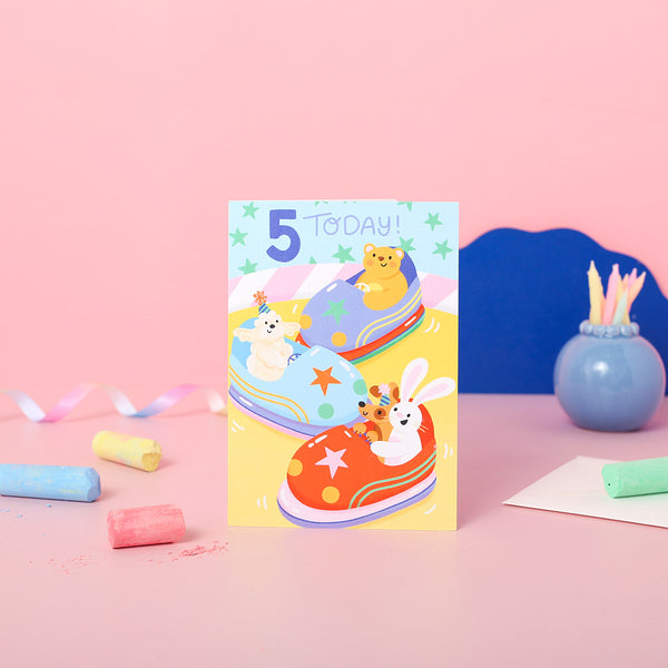 A 5th birthday card with animals on the bumper cars.