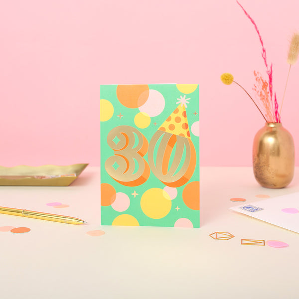 A 30th birthday card with gold foil set on a green background.