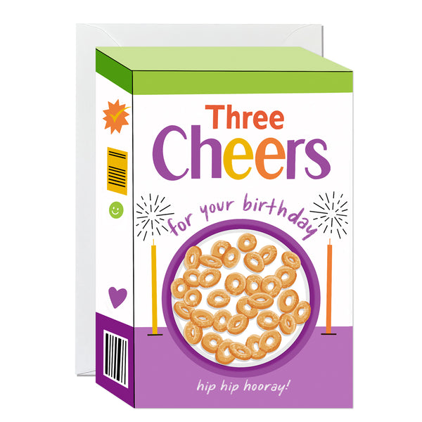 A die-cut birthday card shaped like a retro cereal box with an illustration of a breakfast bowl filled with hoops, celebratory sparklers, and bold typography.