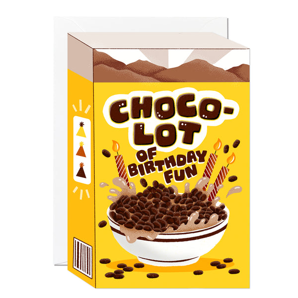 A die-cut greeting card designed as a chocolate cereal box, featuring a hand-illustrated splashing bowl of cocoa cereal and striped birthday candles.