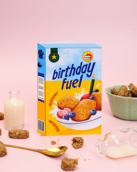 Humorous wheat biscuit cereal box birthday card with fresh berries and a premium glossy Spot UV finish. A witty, unique greeting card for a fun birthday.