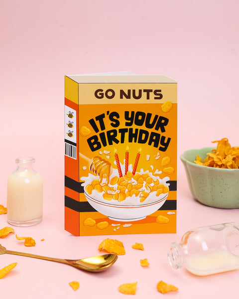 Sweet honey-nut cereal box birthday card with honey bee stripes and a glossy Spot UV finish. A fun, whimsical greeting card perfect for celebrating in style.