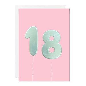 An 18th birthday card featuring big helium balloons printed with an embossed silver foil on a pink card.