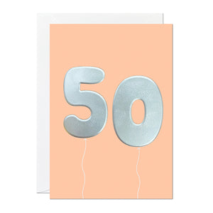 An orange 50th birthday card that has been printed with an embossed silver foil