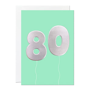A green 80th birthday card that has been printed with an embossed silver foil