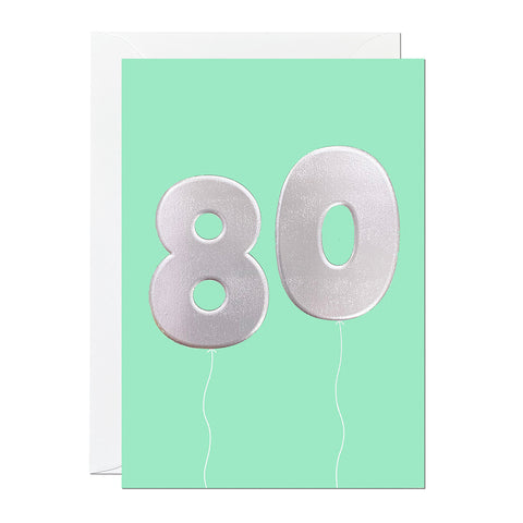 A green 80th birthday card that has been printed with an embossed silver foil