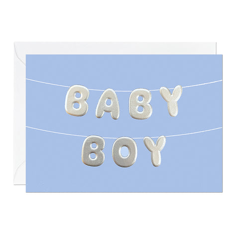 A blue baby boy greeting card featuring letter bunting printed with an embossed foil