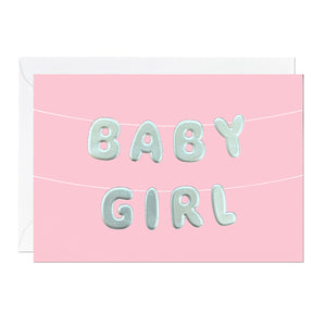 A pink baby girl greeting card featuring letter bunting printed with an embossed foil