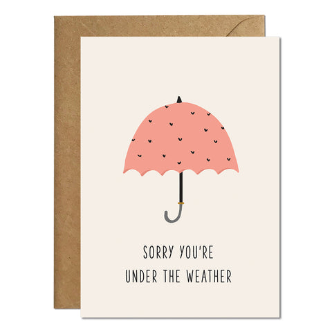 A get well soon greeting card with an illustration of a pink umbrella and a greeting that reads 'sorry you're under the weather'