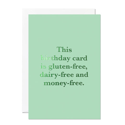 This birthday card is perfect for anyone with a lighthearted sense of humour. It says 'This birthday card is gluten-free, dairy-free and money-free.' It's printed with a luxe green hot foil on a light green background.