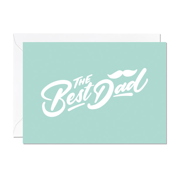 A father's day card that features a hand lettered greeting that reads 'the best dad' printed on a mint green background