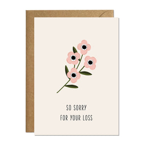 A sympathy card featuring an illustration of a flower and a greeting that reads 'so sorry for your loss'
