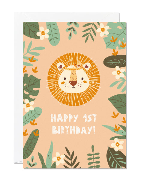 A children's 1st birthday card with the greeting 'happy 1st birthday' featuring an illustration of a lion with jungle foliage around the border
