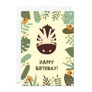 A children's birthday card with the greeting 'happy birthday' featuring an illustration of a zebra with jungle foliage around the border