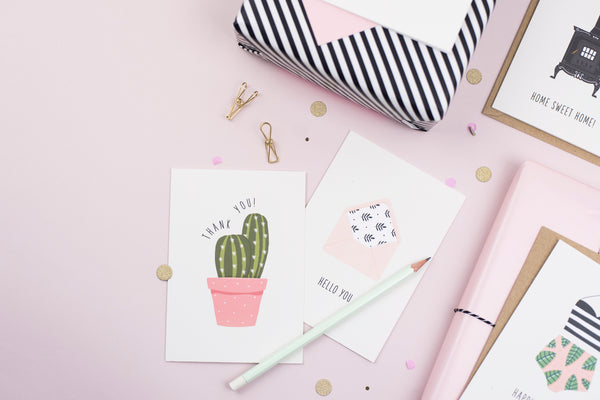 A thank you card featuring an illustration of a potted cactus with the greeting 'thank you'