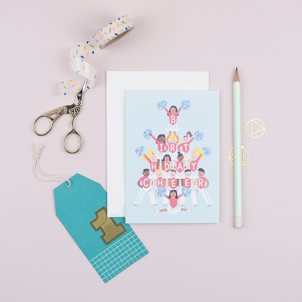 A birthday card featuring a squad of cheerleaders spelling out 'birthday cheer' on their shirts